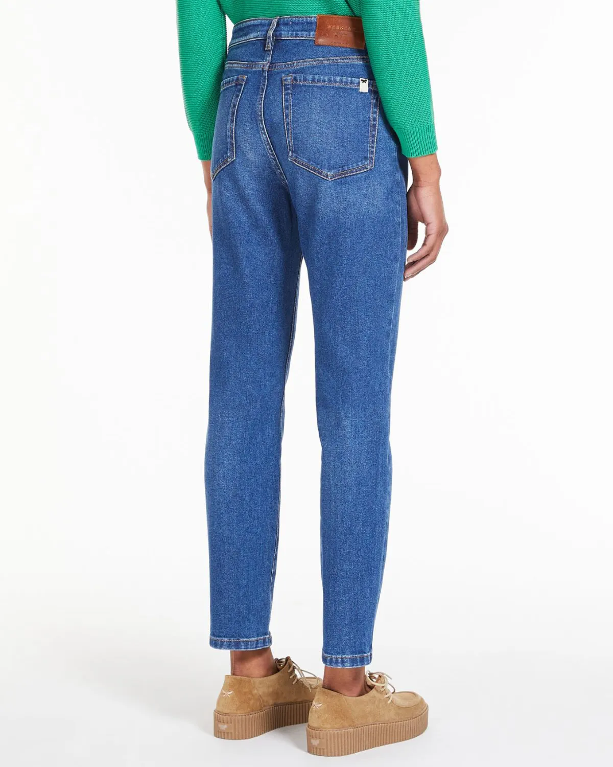 Jeans slim a vita media in cotone stretch lavaggio medio con baffature